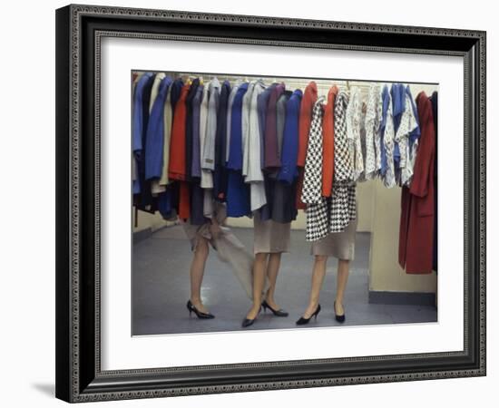 Fashion Models Behind a Suit Rack Trying on Clothes at Zelinka-Matlick, New York, New York, 1960-Walter Sanders-Framed Photographic Print