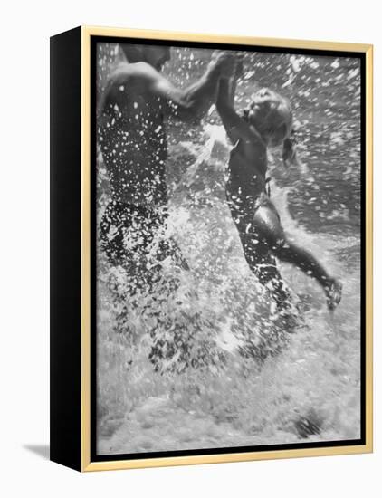 Father and Daughter Playing in the Surf at Jones Beach-Alfred Eisenstaedt-Framed Premier Image Canvas