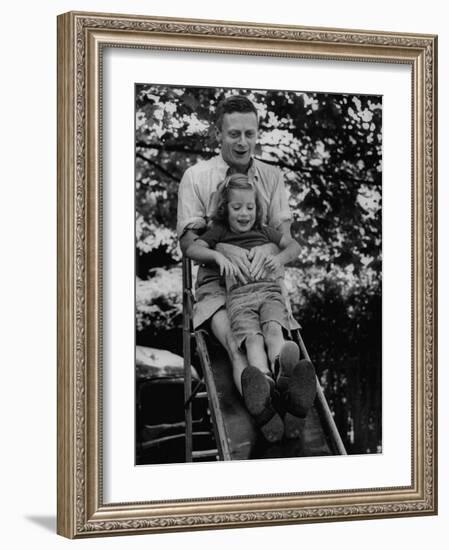 Father and Daughter Playing on Slide During Father's Day at Co-Op Nursery School Owned by Parents-Yale Joel-Framed Photographic Print