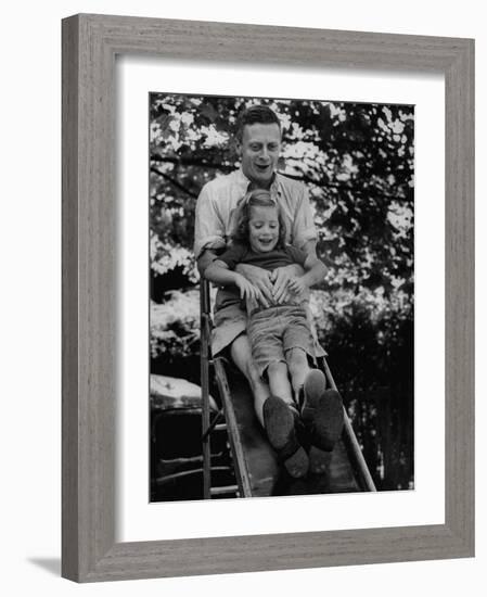 Father and Daughter Playing on Slide During Father's Day at Co-Op Nursery School Owned by Parents-Yale Joel-Framed Photographic Print