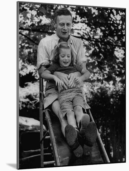 Father and Daughter Playing on Slide During Father's Day at Co-Op Nursery School Owned by Parents-Yale Joel-Mounted Photographic Print