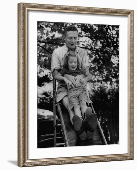 Father and Daughter Playing on Slide During Father's Day at Co-Op Nursery School Owned by Parents-Yale Joel-Framed Photographic Print