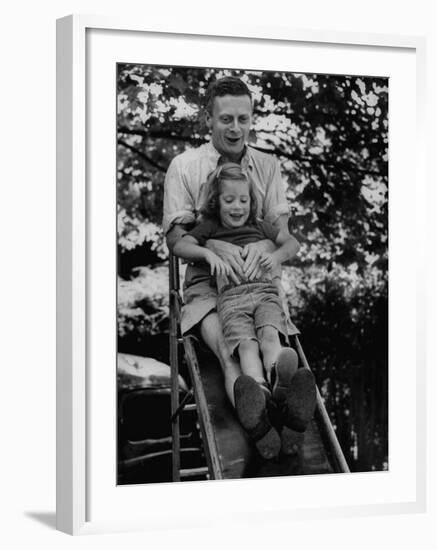 Father and Daughter Playing on Slide During Father's Day at Co-Op Nursery School Owned by Parents-Yale Joel-Framed Photographic Print