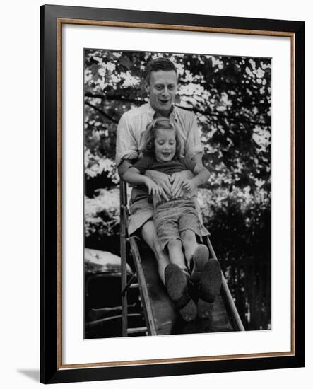 Father and Daughter Playing on Slide During Father's Day at Co-Op Nursery School Owned by Parents-Yale Joel-Framed Photographic Print