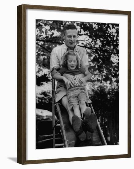 Father and Daughter Playing on Slide During Father's Day at Co-Op Nursery School Owned by Parents-Yale Joel-Framed Photographic Print