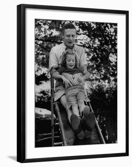 Father and Daughter Playing on Slide During Father's Day at Co-Op Nursery School Owned by Parents-Yale Joel-Framed Photographic Print