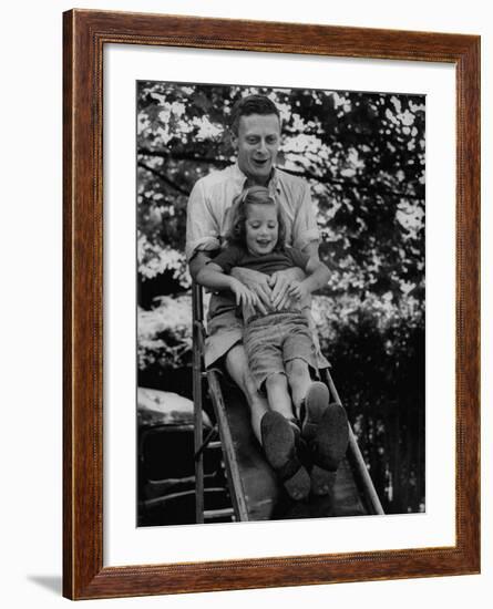 Father and Daughter Playing on Slide During Father's Day at Co-Op Nursery School Owned by Parents-Yale Joel-Framed Photographic Print