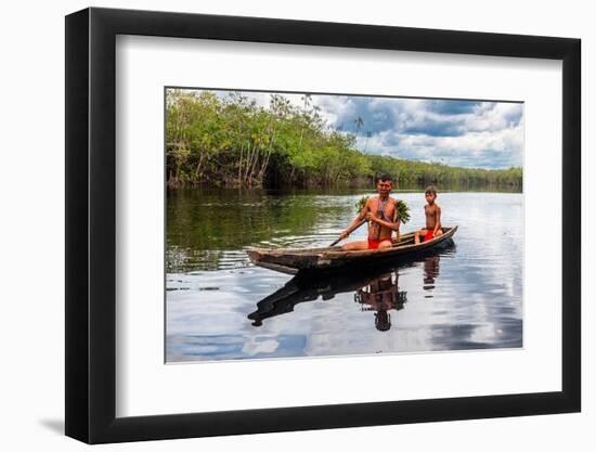 Father and son from the Yanomami tribe in a canoe, southern Venezuela-Michael Runkel-Framed Photographic Print