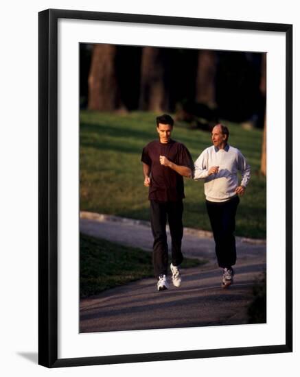 Father and Son Out for a Fitness Run-Paul Sutton-Framed Photographic Print