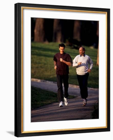 Father and Son Out for a Fitness Run-Paul Sutton-Framed Photographic Print