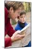 Father And Son Reading a Map-Ian Boddy-Mounted Photographic Print