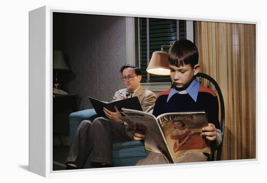 Father and Son Reading at Home-William P. Gottlieb-Framed Premier Image Canvas