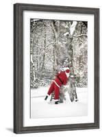 Father Christmas in Snow Behind Tree-null-Framed Photographic Print