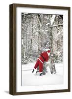 Father Christmas in Snow Behind Tree-null-Framed Photographic Print