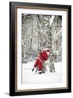 Father Christmas in Snow Behind Tree-null-Framed Photographic Print