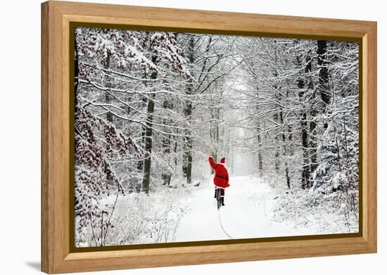 Father Christmas Riding Bicycle Through Beech-null-Framed Premier Image Canvas