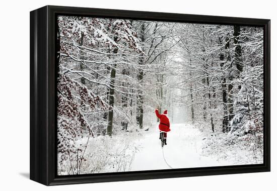 Father Christmas Riding Bicycle Through Beech-null-Framed Premier Image Canvas