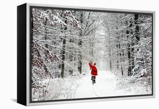 Father Christmas Riding Bicycle Through Beech-null-Framed Premier Image Canvas