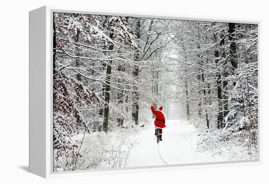 Father Christmas Riding Bicycle Through Beech-null-Framed Premier Image Canvas
