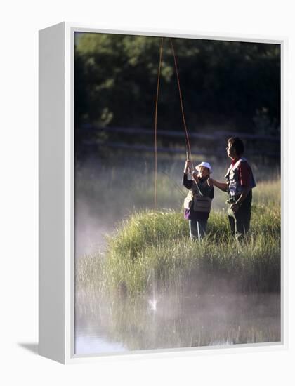 Father Fly Fishing with His Daughter-null-Framed Premier Image Canvas