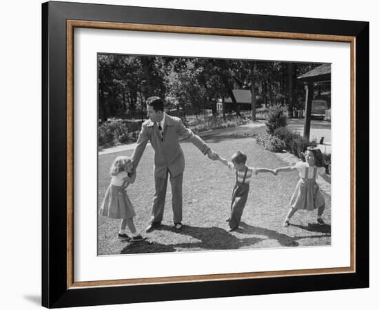 Father Playing in Yard with His Children-Wallace Kirkland-Framed Photographic Print