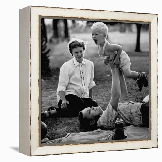 Father Playing with His Child During a Picnic-Allan Grant-Framed Premier Image Canvas