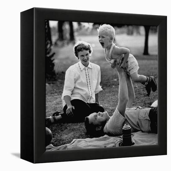 Father Playing with His Child During a Picnic-Allan Grant-Framed Premier Image Canvas