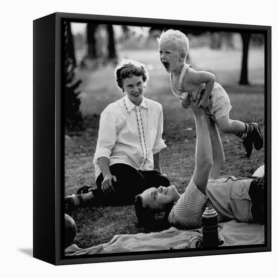 Father Playing with His Child During a Picnic-Allan Grant-Framed Premier Image Canvas