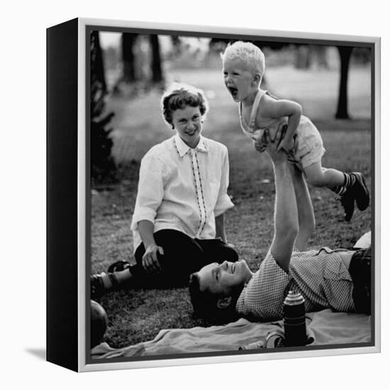 Father Playing with His Child During a Picnic-Allan Grant-Framed Premier Image Canvas