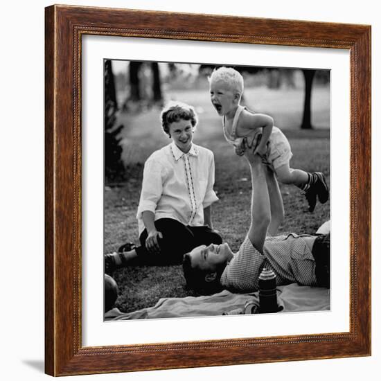 Father Playing with His Child During a Picnic-Allan Grant-Framed Photographic Print