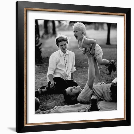 Father Playing with His Child During a Picnic-Allan Grant-Framed Photographic Print