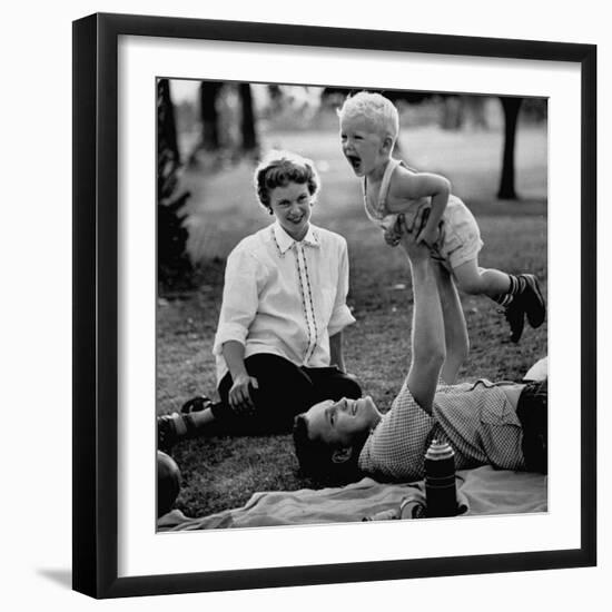 Father Playing with His Child During a Picnic-Allan Grant-Framed Photographic Print