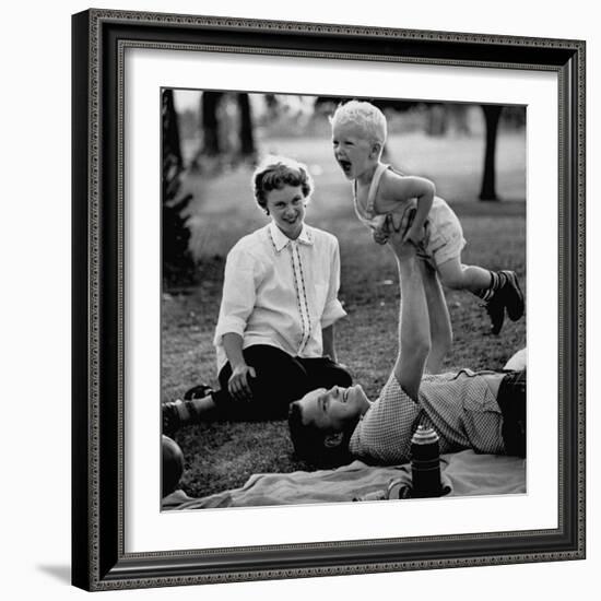 Father Playing with His Child During a Picnic-Allan Grant-Framed Photographic Print