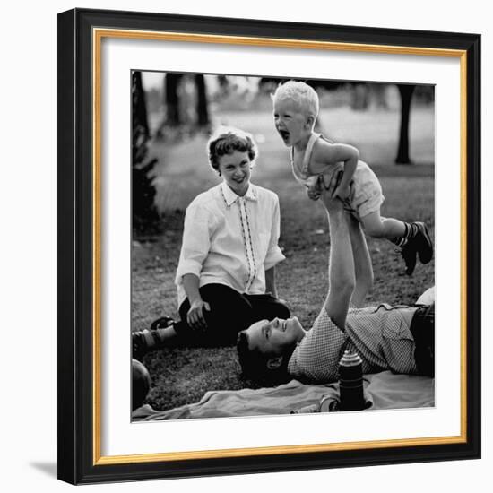 Father Playing with His Child During a Picnic-Allan Grant-Framed Photographic Print