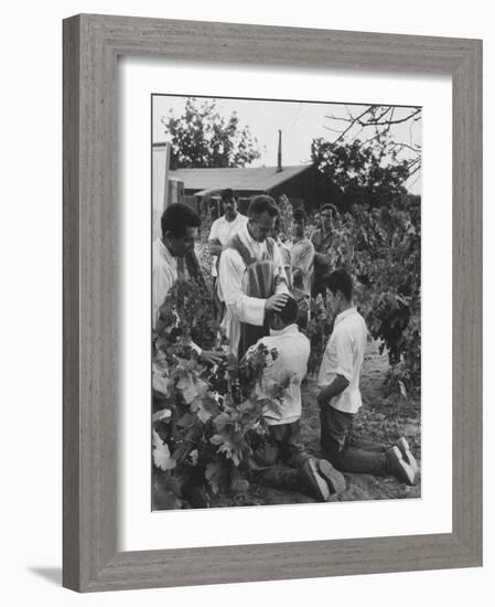 Father Thomas Mccullough Holding Religious Service for Migrant Mexican Farm Laborers in a Work Camp-null-Framed Photographic Print