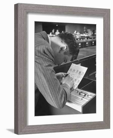 FBI Agent Examining Fingerprints-George Skadding-Framed Photographic Print