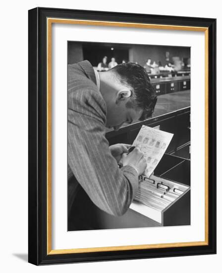 FBI Agent Examining Fingerprints-George Skadding-Framed Photographic Print