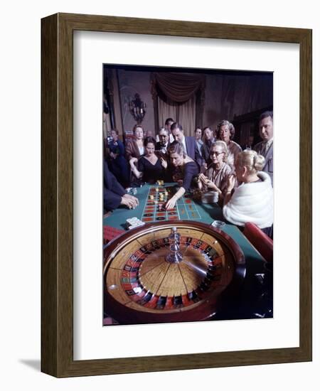 February 11, 1957: Tourists Gambling at the Nacional Hotel in Havana, Cuba-Ralph Morse-Framed Photographic Print