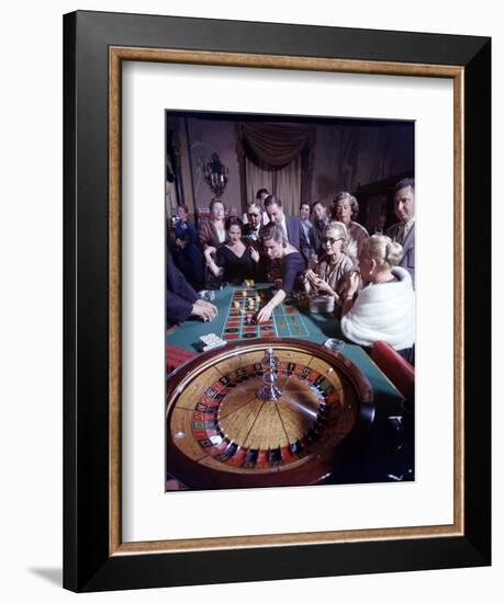 February 11, 1957: Tourists Gambling at the Nacional Hotel in Havana, Cuba-Ralph Morse-Framed Photographic Print