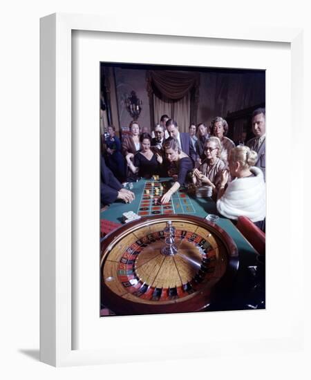 February 11, 1957: Tourists Gambling at the Nacional Hotel in Havana, Cuba-Ralph Morse-Framed Photographic Print