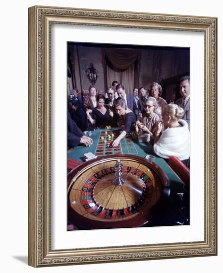 February 11, 1957: Tourists Gambling at the Nacional Hotel in Havana, Cuba-Ralph Morse-Framed Photographic Print