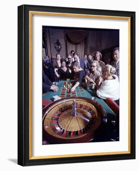 February 11, 1957: Tourists Gambling at the Nacional Hotel in Havana, Cuba-Ralph Morse-Framed Photographic Print