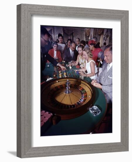 February 11, 1957: Tourists Gambling at the Nacional Hotel in Havana, Cuba-Ralph Morse-Framed Photographic Print