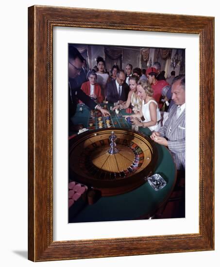 February 11, 1957: Tourists Gambling at the Nacional Hotel in Havana, Cuba-Ralph Morse-Framed Photographic Print