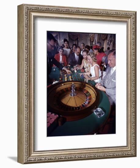 February 11, 1957: Tourists Gambling at the Nacional Hotel in Havana, Cuba-Ralph Morse-Framed Photographic Print