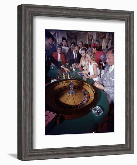 February 11, 1957: Tourists Gambling at the Nacional Hotel in Havana, Cuba-Ralph Morse-Framed Photographic Print