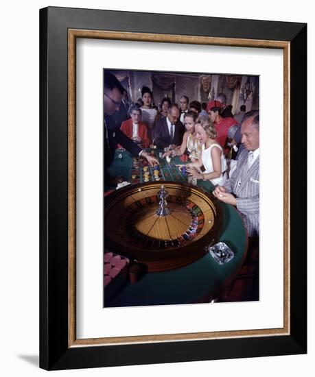 February 11, 1957: Tourists Gambling at the Nacional Hotel in Havana, Cuba-Ralph Morse-Framed Photographic Print