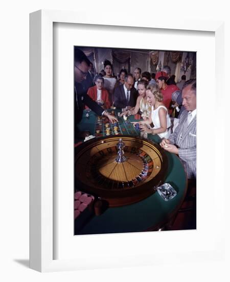 February 11, 1957: Tourists Gambling at the Nacional Hotel in Havana, Cuba-Ralph Morse-Framed Photographic Print