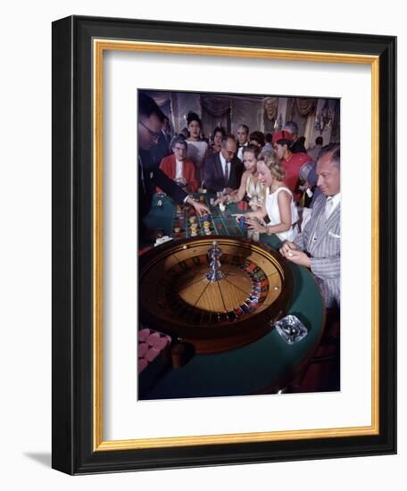 February 11, 1957: Tourists Gambling at the Nacional Hotel in Havana, Cuba-Ralph Morse-Framed Photographic Print