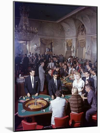 February 11, 1957: Tourists Gambling at the Nacional Hotel in Havana, Cuba-Ralph Morse-Mounted Photographic Print